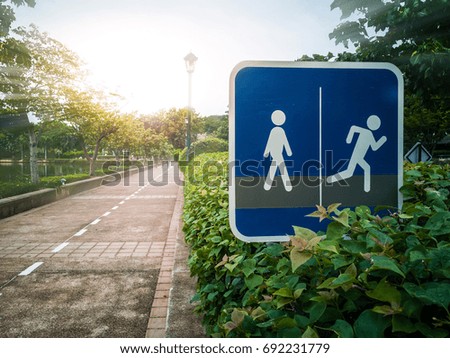 Walking sign in the park at the morning