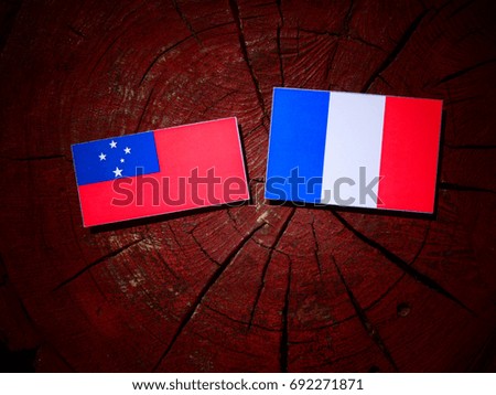 Samoa flag with French flag on a tree stump isolated