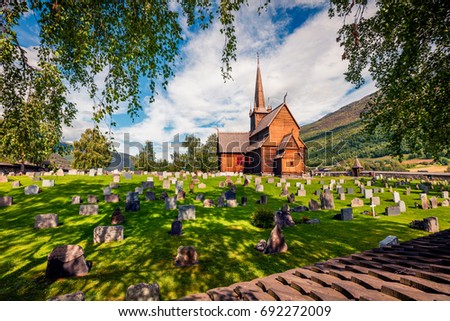 Picturesque summer view of Lom stave church (Lom Stavkyrkje). Sunny morning scene of Norwegian countryside, administrative centre of Lom municipality - Fossbergom, Norway, Europe.
