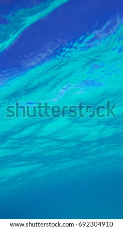 Underwater view of the surface during a bright sunny day. Nassau, Bahamas.