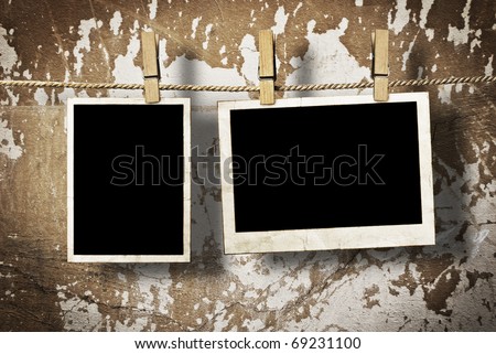 Film Blanks Hanging on a Rope Held By Clothespins on a Grunge Background