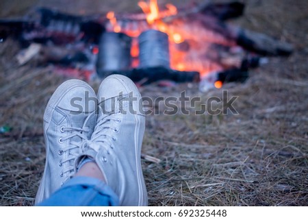 Legs around the campfire