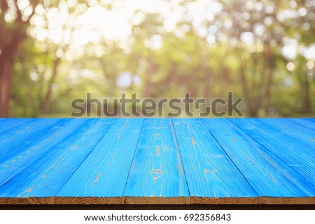 Empty space of top vintage wooden table or counter and sunny abstract blurred bokeh background. For photo montage or product display design