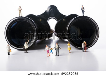 Miniature people crowd with binoculars ower white background