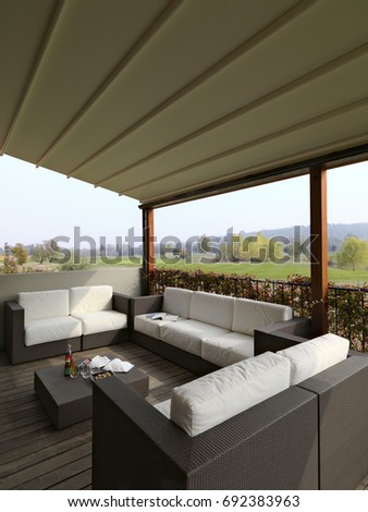 external photographing in foreground the modern fabric sofas and wicker in the  porch overlooking on the golf course