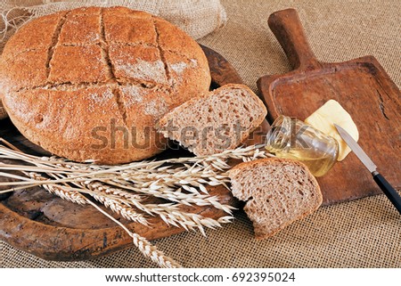 Decoration  with round integral bread on wooden board, note shallow depth of field