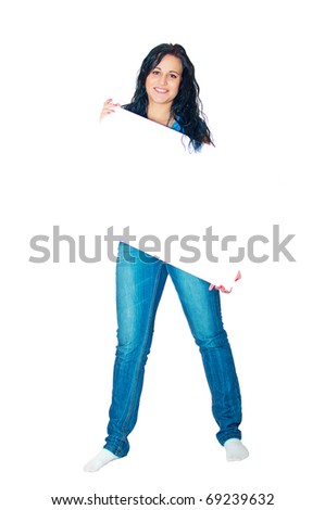 Full length portrait of a beautiful young smiling woman holding empty board against white background