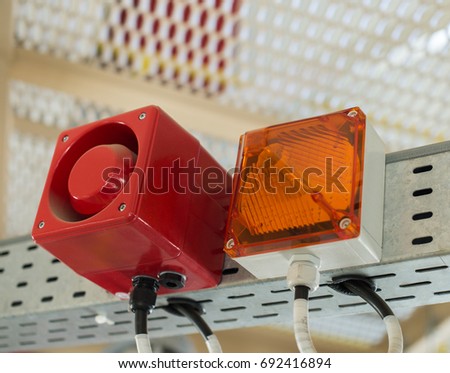 The fire alarm system. The combination of sound and light alert. Royalty-Free Stock Photo #692416894