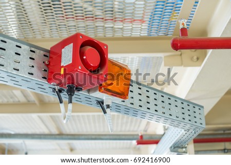 The fire alarm system. The combination of sound and light alert. Royalty-Free Stock Photo #692416900