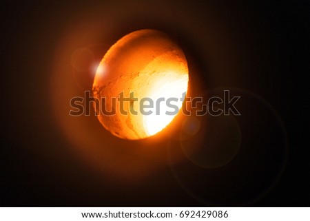 Macro picture of casting. Production of copper. Melting furnace on a black background. Copper foundry. Bright molten steel. 