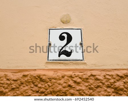 number 2 house number on the wall two (2)
