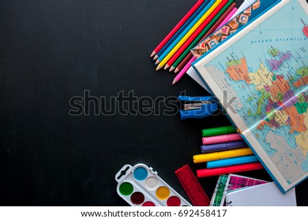 Back to school concept.School and office supplies on black background. Flat lay with copy space. Royalty-Free Stock Photo #692458417