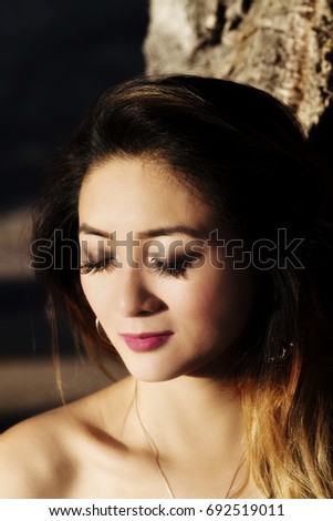 Setting Sun Outdoor Portrait Attractive Asian American Woman With Eyes Closed