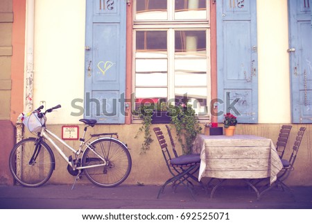 Old European Cafe With Bicycle - Travel Background - Vintage Filter Royalty-Free Stock Photo #692525071