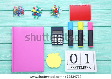 School supplies on mint wooden table
