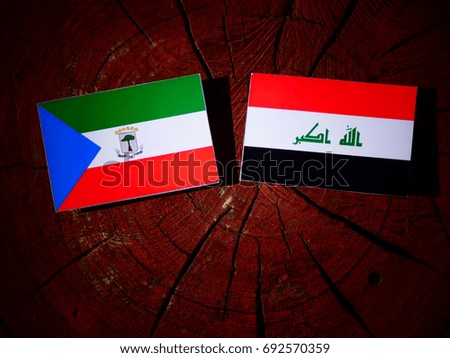 Equatorial Guinea flag with Iraqi flag on a tree stump isolated