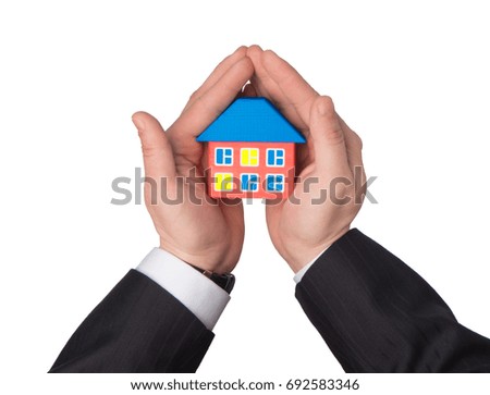 House in hand as a symbol of insurance