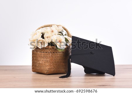 Congratulations flower and hat for text university graduates Royalty-Free Stock Photo #692598676