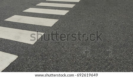 Zebra crossing line on asphalt texture