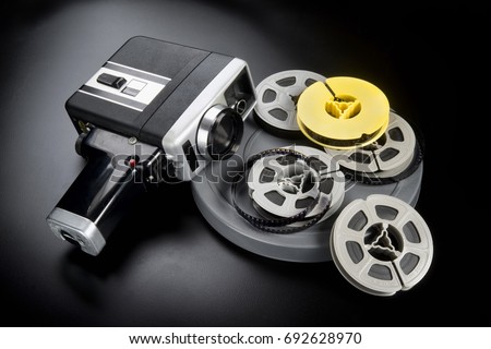 8mm movie camera and reels of film.
