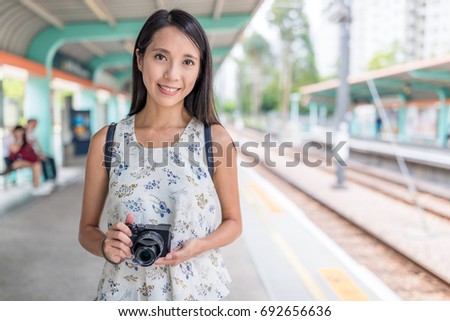 Woman go travel with her camera