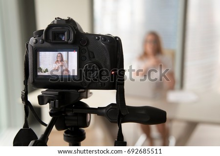 Professional digital equipment recording video blog of businesswoman, online business coach making presentation for website, filming popular vlog or master class for videoblog channel, focus on camera Royalty-Free Stock Photo #692685511