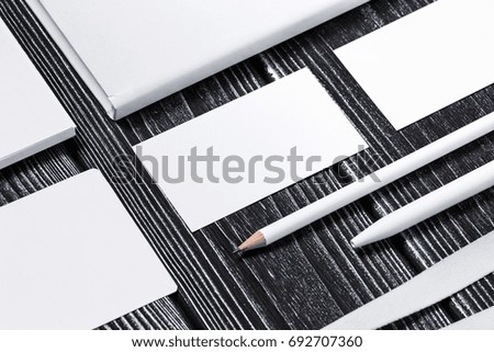 Corporate branding mockup template, isolated on dark wooden background.