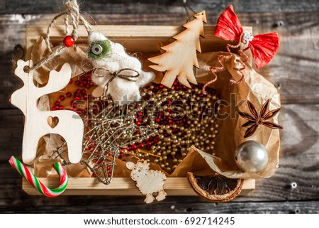 Christmas decorations in a wooden box on a wooden background winter holidays concept