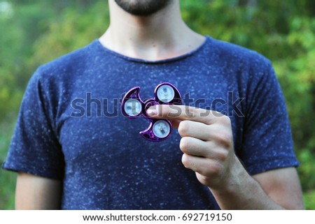 Spinner in the hands of a teenager