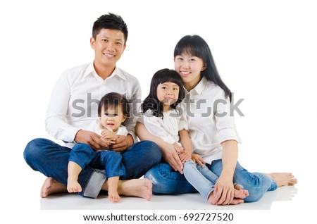 Portrait of a happy asian family in the studio Royalty-Free Stock Photo #692727520