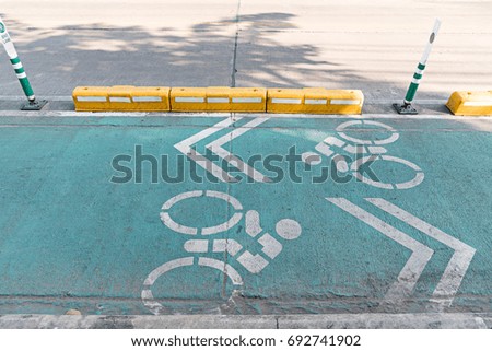 sign in green bicycle lane