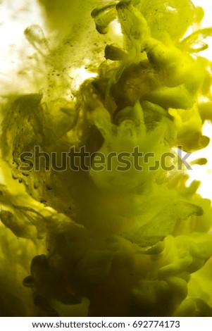 yellow ink in water isolated on white background