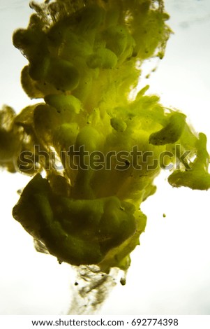 yellow ink in water isolated on white background