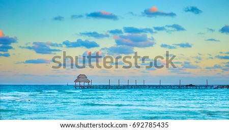 Vacations And Tourism Concept - Tropic Paradise in the early morning hours. Jetty on Isla Mujeres - Mexico, Cancun