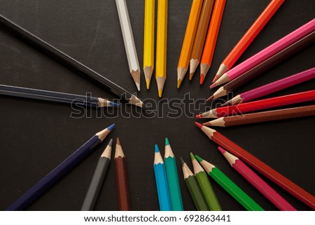 Colored crayons on the table