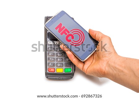 Payment in trade with the nfc system with a mobile phone. Top view, white background