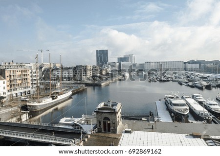 ANTWERP, BELGIUM - FEBRUARY 3RD 2015: Aerial view of Antwerp harbor from museum MAS roof terrace Royalty-Free Stock Photo #692869162