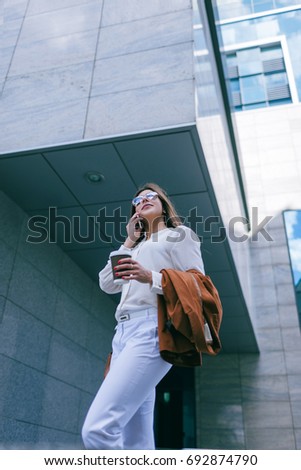 Female employee on coffee break. Stylish business woman, modern social communication