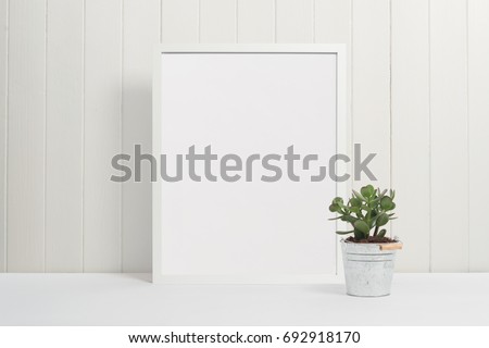 White picture frame with plant pot