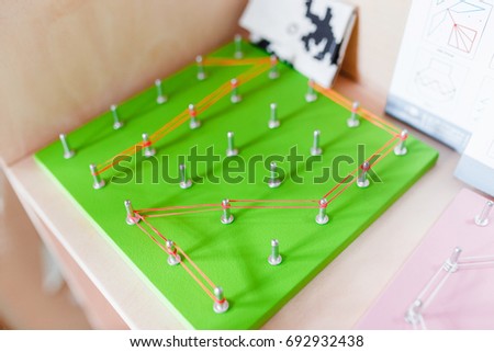 Modern Colorful educational board game for children of pins and rubber bands