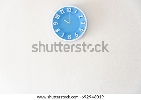 Morning, night or bed time with 10:00 clock on white concrete wall interior background with copy space, message board concept. 10 am is the late time in the morning. 10 pm is the bed time in the night