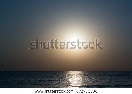 Phantasmagoric golden sunset on the sea