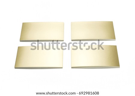 Golden business cards isolated on white, studio shot.