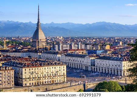 The city center of Turin with Mole Antonelliana tower and Alps mountains panorama, Turin, Italy Royalty-Free Stock Photo #692991079