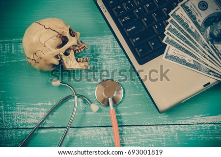 skull and stethoscope on wood concept health care