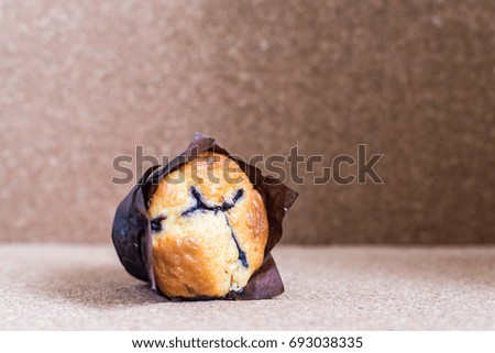 Dessert - Blueberry Muffin on wood background. Shallow depth of field. Selective focus. Copy Space.