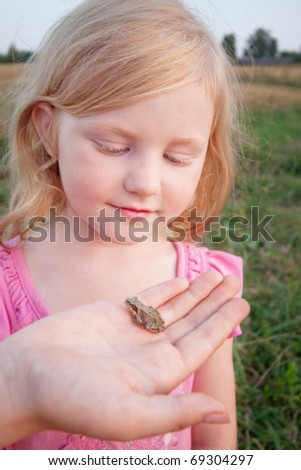 little girl with frog