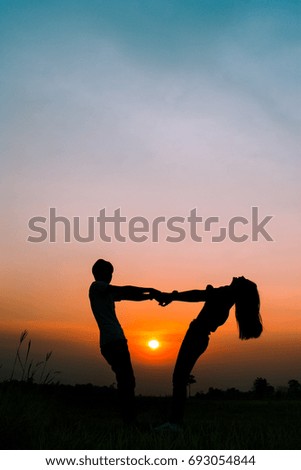 silhouette of a romantic couple on sunset.