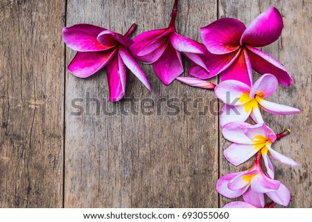 Close-up,Beautiful Plumeria on old wooden background, with Copy space for text or product.