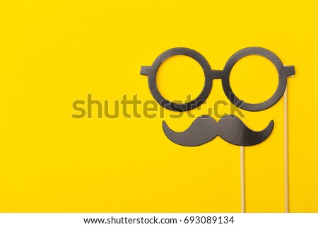 Photobooth props on a yellow background. Birthday, wedding party celebration Royalty-Free Stock Photo #693089134